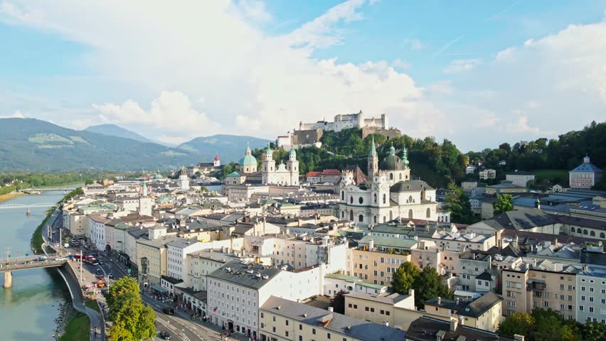 aerial drone panorama of Salzburg city in Austria. View of the historic city of Salzburg and Salzach river at summer