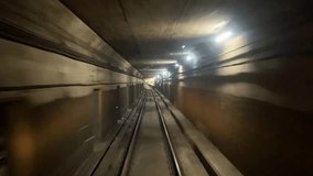 SUBWAY TRAIN TUNNEL - Timelapse video traveling through underground subway tunnel at high speed. Urban metro transit and transportation in dense city setting. One point perspective. Toronto, Canada