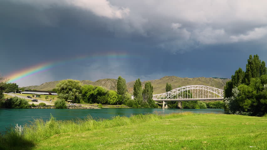 Arched white color bridge in Alexandra town, New Zealand, just before rainfall