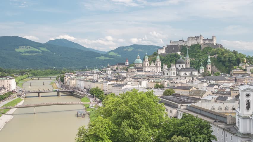 Salzburg Austria time lapse 4K, city skyline timelapse at Salzace River and Fortress Hohensalzburg