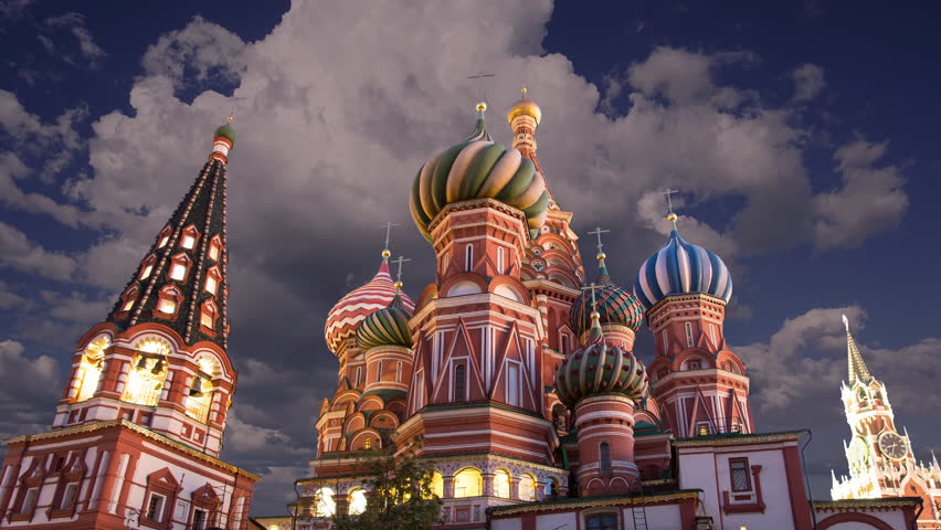 Cathedral of Intercession of Most Holy Theotokos on the Moat ( Temple of Basil the Blessed) against the background of moving clouds (at night),  Red Square, Moscow, Russia (time lapse)