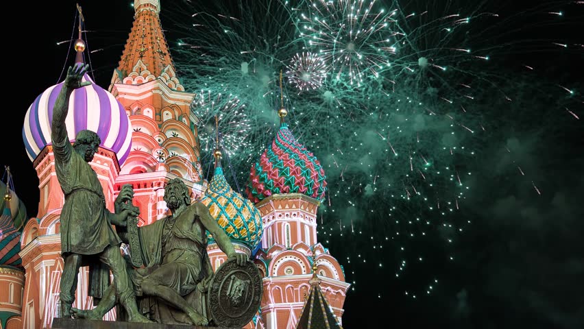 Celebratory colorful fireworks and Cathedral of Intercession of Most Holy Theotokos on the Moat ( Temple of Basil the Blessed),  Red Square, Moscow, Russia (time lapse, with zoom)