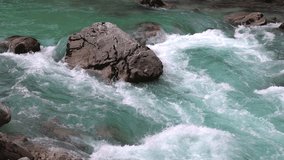 Alpine River Flowing over a Rock Close Up Video