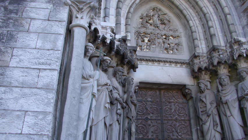 Sculptures of the Holy Apostles near the main entrance to the Cathedral of St. Finbarr in the Irish city of Cork. Statues adorn the facade of the Anglican church. European religious art.