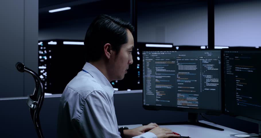 Close Up Side View Of Asian Male Programmer Being Stressed And Tired Of Writing Code By Desktops Using Multiple Monitors Showing Database On Terminal Window In The Server Room
 Royalty-Free Stock Footage #1099862323