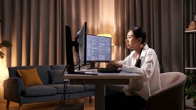 Asian Woman Programmer Yawning And Sleeping While Creating Innovative Software Engineer Developing App, Program, Video Game On Desktop Computer At Home. Terminal With Coding Language 
