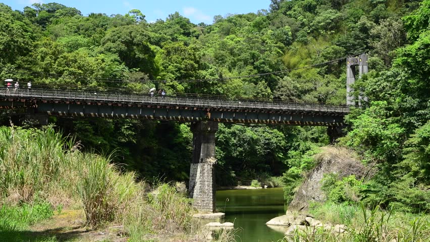 New Taipei City, Taiwan- August 16, 2022: Video of the Pingxi Branch Rail Line train driving pasting the Shifen Scenic Area in New Taipei City, Taiwan.