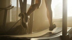 Close-up view of unrecognized caucasian lady building endurance and burning calories. Slim female legs running on treadmill machine during intensive CrossFit training. High quality 4k footage - Powered by Shutterstock - Get 15% off with code: PIKWIZARD15
