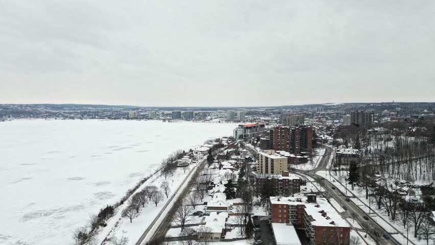 Barrie Ontario downtown snowing next to lake simcoe  Barrie text in a 3d motion graphic 