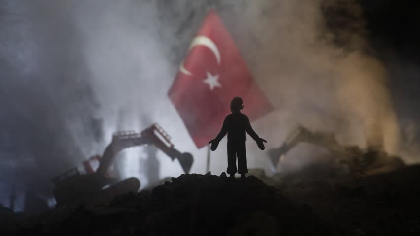 Turkey Earthquake happend in February 2023. Decorative photo with Turkish flag, and ruined city buildings. Pray for Turkey. Selective focus | Shutterstock HD Video #1099881341