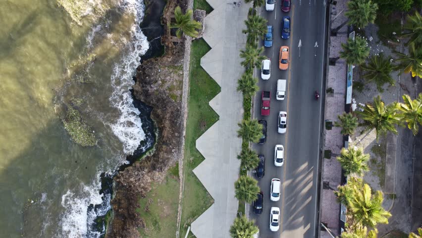 Cars drive on the road along Santo Domingo