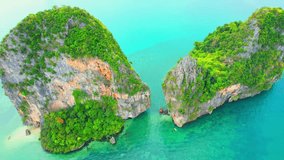 Aerial view over Railay Beach, coastal limestone mountains. Krabi, Thailand. One of the most beautiful tropical seas in the world. Incredible travel destinations on Earth. Travel and Nature concept
