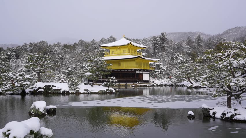 Snowy Kinkaku-ji Temple in winter. Famous tourist attraction in Kyoto, Japan. The Golden Pavilion, Kinkakuji, rokuon-ji, rokuon-ji. Snow landscape.