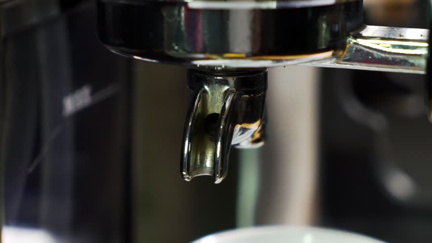 CU SLOW MOTION Espresso Pouring out of porta filter spout. Coffee pouring out of Coffee Machine. | Shutterstock HD Video #1099892945