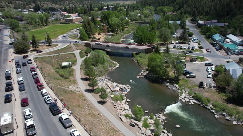 Pagosa Spring, Colorado USA. Aerial View of Bridge Traffic Above San Juan River, Streets and Landscape