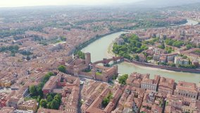 Inscription on video. Verona, Italy. Flying over the historic city center. Castelvecchio Castello Scaligero, summer. Glitch effect text, Aerial View, Point of interest