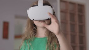 Modern Education Child in Virtual Reality Glasses, Learning in Virtual Reality, Girl Immersed in Cyberspace. Child Playing Games On Virtual Reality Device. Girl Learning Using Virtual Reality Headset - Powered by Shutterstock - Get 15% off with code: PIKWIZARD15