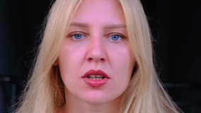 Woman screams in rage with her mouth wide open staring at camera. Aggression, indignation. Close-up headshot of blue-eyed blonde experiencing an overabundance of emotions. Hysteria, screaming - Powered by Shutterstock - Get 15% off with code: PIKWIZARD15