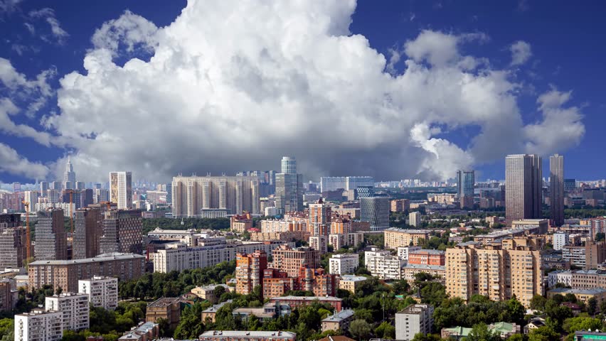 Aerial view of center of Moscow against the background of the sky with clouds  (time lapse, with zoom), Russia  