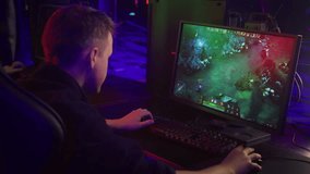 Player enjoying the new strategic MOBA video game. Player instructing the team to attack the rival boss character in a video game. Player losing a battle in an internet video game. Defeat Screen.