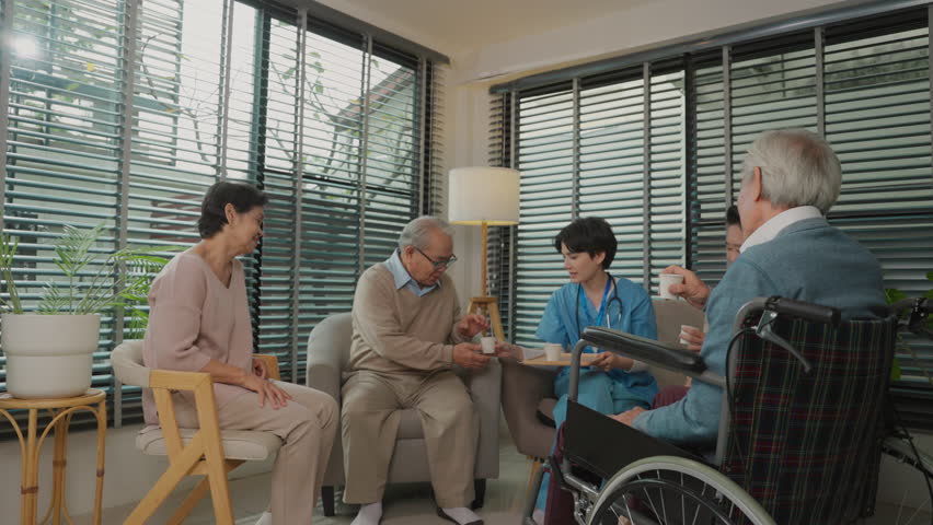 Slow motion of Young Asian nurses are dispense medicines to elderly people in nursing homes to treat illness of the retirement age and have good health. wellness and good quality of life Royalty-Free Stock Footage #1099910541