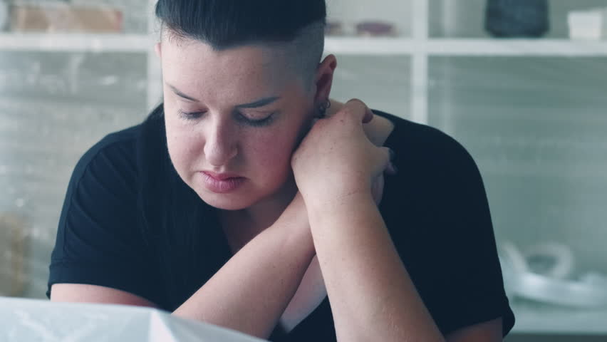 Loneliness depression. Emotional crisis. Disappointment frustration. Troubled upset pensive tired overweight woman sighing alone at home interior. | Shutterstock HD Video #1099916003