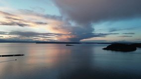 Incredible Sunset over the coasts of British Columbia, Boat moving, clouds, BC, Canada