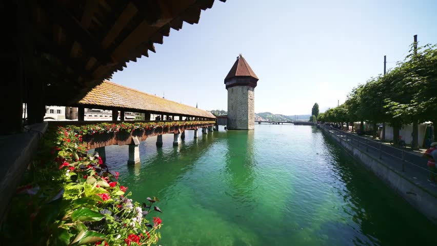 Lucerne, Switzerland. Historic city center with famous Chapel Bridge. Tourist destination in summer. 
