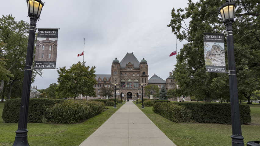 Hyperlapse of Ontario Legislative Building in Toronto with looming stormy, overcast sky behind