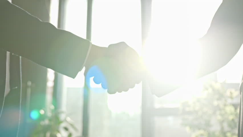 Close-up male office corporate handshaking. Two unrecognizable men shake hands in company meeting sunny sun background. Diverse businessmen handshake successful business deal partnership cooperation | Shutterstock HD Video #1099927909