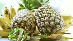4K video of pineapples and bananas.