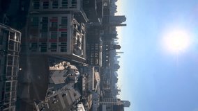 Vertical timelapse from above, view of New York from the Williamsburg district, USA. Buildings roofs, office and industrial builings, streets, endless city under the bright sky