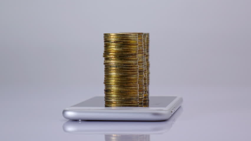 coins stack increase on smart phone with business data hologram. business growth concept.	 Royalty-Free Stock Footage #1099932841