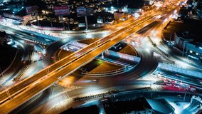 Hyperlapse time-lapse of car traffic transportation above circle roundabout road in urban downtown Asian city at night. Drone aerial view, high angle. Public transport or commuter city life concept - Powered by Shutterstock - Get 15% off with code: PIKWIZARD15