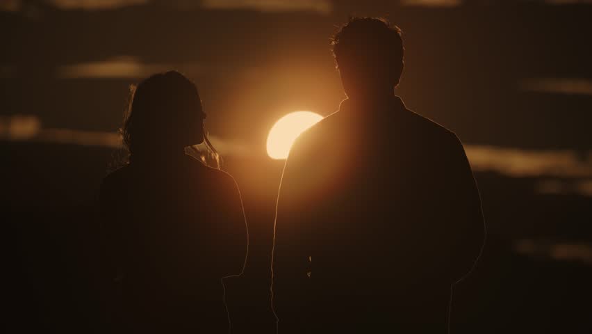 Romantic couple enjoying scenic view of sunset, boulder, utah, united states