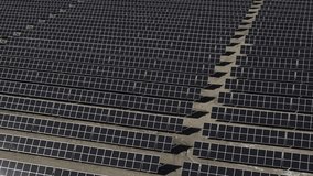 Aerial flyover view of large group of solar panels in field, price, utah, united states