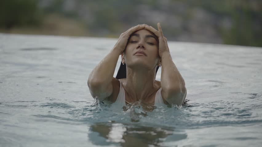 Slow motion close up of smiling woman swimming to camera, cedar hills, utah, united states | Shutterstock HD Video #1099941001