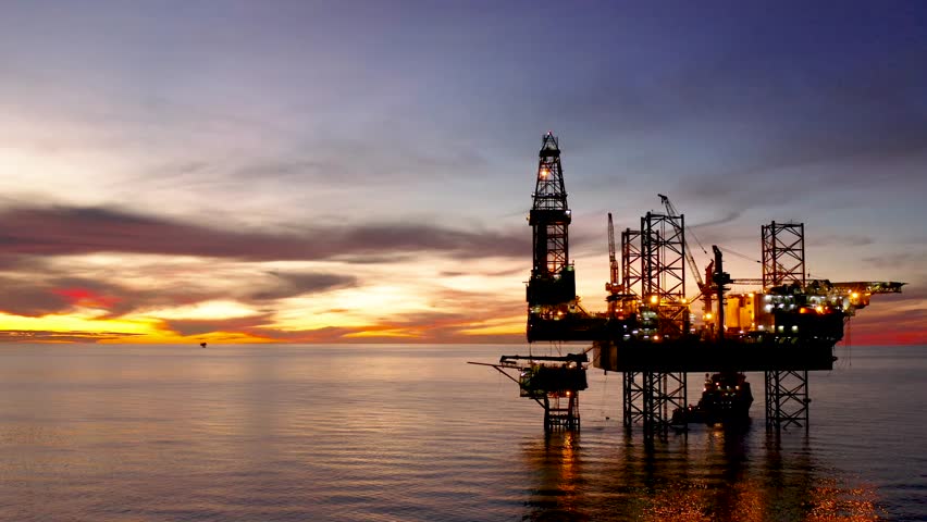 Aerial view of offshore jack up drilling rig during sunset - oil and gas industry
 Royalty-Free Stock Footage #1099943073