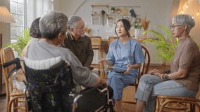 Group of asian senior people listening to young nurse.Psychological support group for elderly and lonely people in community centre. Group elderly therapy in session sitting in circle in nursing home - Powered by Shutterstock - Get 15% off with code: PIKWIZARD15