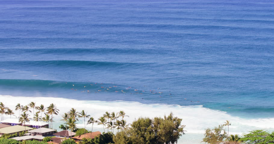 Slow Motion High-Angle View Of A Group Of Surfers And Giant Crashing Waves And Coastline (Shot On Red) - Oahu, Hawaii
