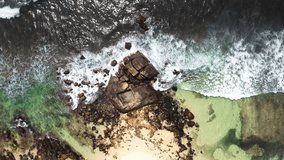 Dalawella Beach Indian ocean waves washing the dark stones beautiful Nature's landmark 4K video in Unawatuna, Galle District on Sri Lanka. Exotic Asian countries and around the World traveling concept