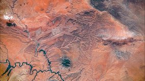 Aerial view of Lake Powell, Southeastern Utah and Northeastern Arizona, USA. San Juan River, Monument Valley, Navajo Mountain and Black Mesa seen from the top. Elements of this video furnished by NASA