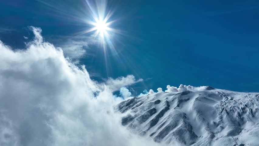 Aerial shot with drone of Etna in winter. Snow-covered craters, Etna in activity, Valle del Bove and summit craters. Snowy woods. South-East, North-East, Voragine, Bocca Nuova. 