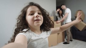 Video of a girl showing off her new apartment during a video conference. Shows his family and new apartment via smartphone