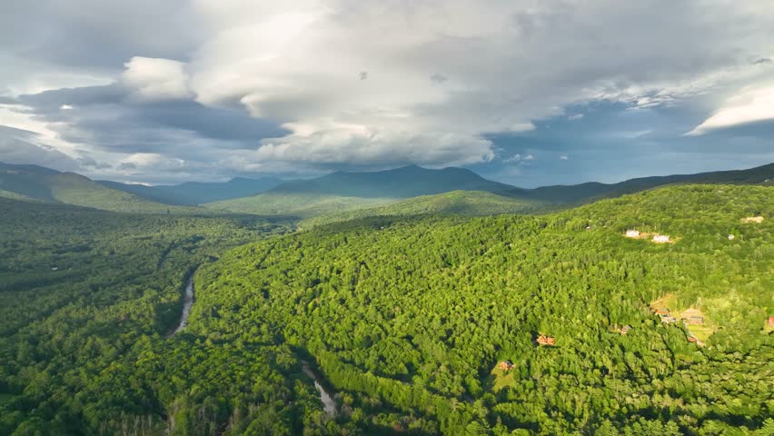 Raining cloud aerial view over the Campton Mountain in summer with White Mountain National Forest at the background in town of Campton, New Hampshire NH, USA. 