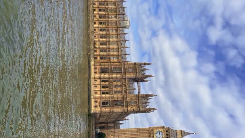 Vertical shot of London Westminster Bridge, Palace of Westminster Big Ben and Thames River England, United Kingdom on a beautiful sunny day Royalty-Free Stock Footage #1099965897