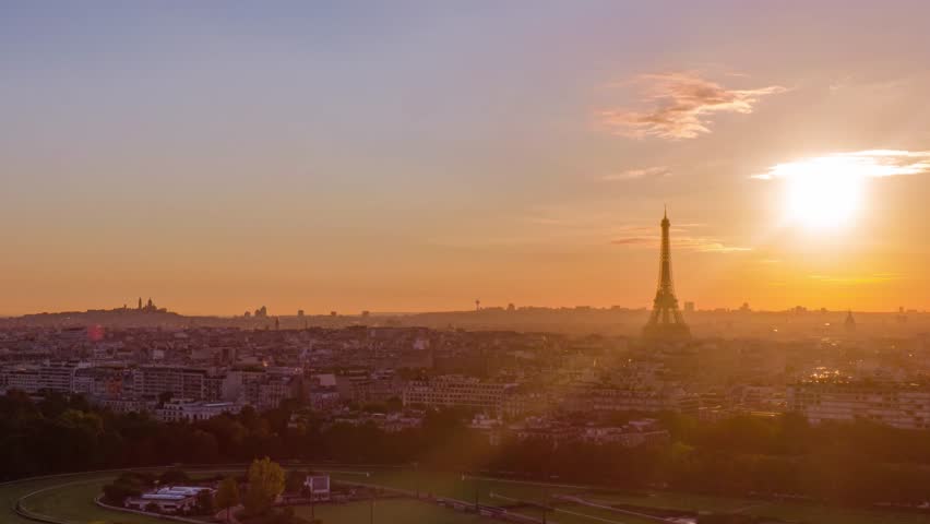 Aerial Panoramic Drone Hyper-lapse of Paris Tour Eiffel Tower and Sacre Coeur Cathedral in France Hyper lapse Time lapse on a beautiful sunrise with sun-flare view  Royalty-Free Stock Footage #1099966013