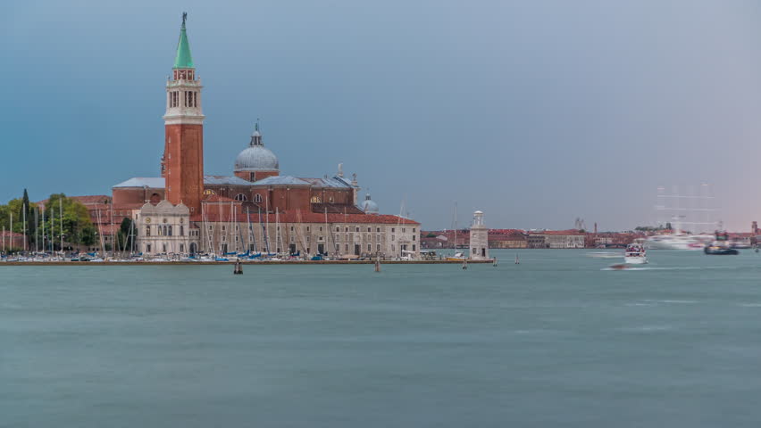 Panoramic sea view of the San Giorgio Maggiore island timelapse in Venice, Italy. Cloudy summer day. Boats and ship passing by on the water