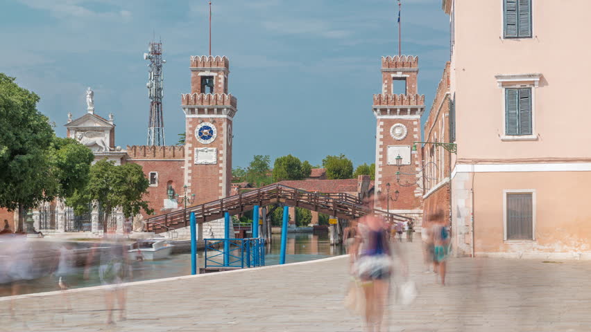 Entrance to the Arsenale timelapse, Venice, Veneto, Itlay. Campo de l'Arsenale with the canal and Ponte de l'Arsenal o del Paradiso on a sunny day with few tourists on a waterfront Royalty-Free Stock Footage #1099968577