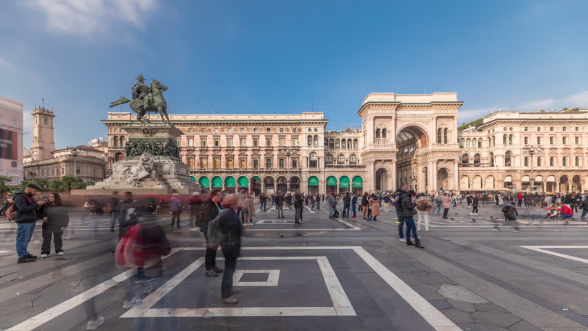Panorama showing horse statue with Milan Cathedral and other historic buildings timelapse. Duomo di Milano is the cathedral church located at the Piazza del Duomo square in Milan city in Italy Royalty-Free Stock Footage #1099968581